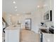 Modern kitchen featuring stainless steel appliances and light-colored cabinetry at 3923 Windstar Way, Columbus, IN 47203