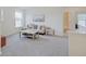 Bright bonus room features a cozy sitting area and plenty of natural light at 3923 Windstar Way, Columbus, IN 47203