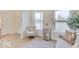 Living area with comfy arm chair and large windows at 3923 Windstar Way, Columbus, IN 47203
