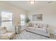 Cozy living room featuring a comfy sofa and large windows at 3923 Windstar Way, Columbus, IN 47203