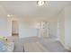 Upstairs bonus area with high ceilings and neutral color palette at 3923 Windstar Way, Columbus, IN 47203