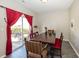 Charming dining room with wooden table and seating for six at 4620 Whitham Ln, Indianapolis, IN 46237