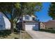 Two-story home with attached garage and landscaping at 4620 Whitham Ln, Indianapolis, IN 46237