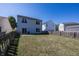 Large backyard with grassy area and wooden fence at 4620 Whitham Ln, Indianapolis, IN 46237