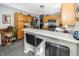 Modern kitchen with stainless steel appliances and breakfast bar at 4620 Whitham Ln, Indianapolis, IN 46237