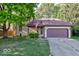 Two-story house with a large yard and attached garage at 7932 Eagle Valley Pass, Indianapolis, IN 46214