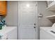 Laundry room with washer, dryer, and extra shelving at 7932 Eagle Valley Pass, Indianapolis, IN 46214