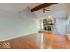 Spacious living room with hardwood floors and a stone fireplace at 7932 Eagle Valley Pass, Indianapolis, IN 46214
