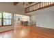 Open-concept living room and dining area with hardwood floors at 7932 Eagle Valley Pass, Indianapolis, IN 46214