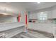 Kitchen with white cabinets and a breakfast bar at 7932 Eagle Valley Pass, Indianapolis, IN 46214