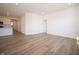 Hardwood floor living room with access to kitchen and other rooms at 231 Lar Lan Dr, Danville, IN 46122