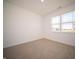 Spacious bedroom with neutral carpeting and large window at 231 Lar Lan Dr, Danville, IN 46122