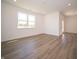 Bright bonus room featuring hardwood floors and a door to exterior at 231 Lar Lan Dr, Danville, IN 46122