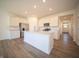 Modern kitchen with island, stainless steel appliances, and white cabinets at 231 Lar Lan Dr, Danville, IN 46122