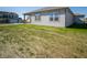 New construction home with a grassy backyard and patio at 231 Lar Lan Dr, Danville, IN 46122