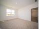 Well-lit bedroom with neutral carpet and an exterior view at 231 Lar Lan Dr, Danville, IN 46122