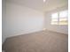 Spacious bedroom with neutral carpeting and large window at 231 Lar Lan Dr, Danville, IN 46122