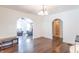 Spacious dining area with hardwood floors and archways leading to other rooms at 532 E Mills Ave, Indianapolis, IN 46227