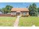 Brick house with brown awning, landscaping, and walkway at 532 E Mills Ave, Indianapolis, IN 46227