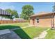 Large backyard with shed, walkway, and wooden fence at 532 E Mills Ave, Indianapolis, IN 46227