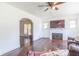 Living room with hardwood floors, fireplace, and a view into another room at 532 E Mills Ave, Indianapolis, IN 46227