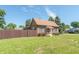 Brick house with brown awning, landscaping, and walkway at 532 E Mills Ave, Indianapolis, IN 46227