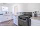 Updated kitchen featuring black appliances and a sleek countertop at 532 E Mills Ave, Indianapolis, IN 46227