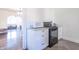 Modern kitchen with white cabinets and black appliances at 532 E Mills Ave, Indianapolis, IN 46227