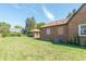 Large backyard with grassy area, shed, and air conditioning unit at 532 E Mills Ave, Indianapolis, IN 46227