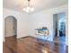Bright dining room with hardwood floors and views into adjacent rooms at 532 E Mills Ave, Indianapolis, IN 46227