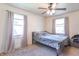 Cozy bedroom with ceiling fan, neutral decor, and carpeted floors at 532 E Mills Ave, Indianapolis, IN 46227