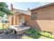 Brick home with awning covered side porch and small garden at 532 E Mills Ave, Indianapolis, IN 46227
