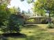 View of a green shed and trees in backyard at 431 Vestal Rd, Plainfield, IN 46168