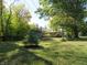 Landscaped backyard with shed and trees at 431 Vestal Rd, Plainfield, IN 46168