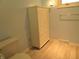 Bathroom with linen cabinet and light wood flooring at 431 Vestal Rd, Plainfield, IN 46168