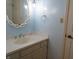 Vanity with vessel sink and decorative mirror in light blue bathroom at 431 Vestal Rd, Plainfield, IN 46168