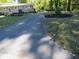 Long driveway leading to house with landscaping at 431 Vestal Rd, Plainfield, IN 46168