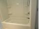 Clean shower and tub combo with built-in shelves at 431 Vestal Rd, Plainfield, IN 46168