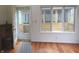 Sunroom with hardwood floors, door to deck and screened porch view at 431 Vestal Rd, Plainfield, IN 46168
