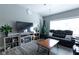 Living room features a fireplace, large TV, and comfortable seating at 6611 Ventnor Pl, Indianapolis, IN 46217