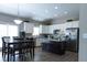 Eat-in kitchen with white cabinets, granite counters, and stainless steel appliances at 6611 Ventnor Pl, Indianapolis, IN 46217