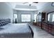 Bright bedroom featuring a king-size bed and ample closet space at 6611 Ventnor Pl, Indianapolis, IN 46217