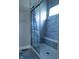 Large walk-in shower with glass enclosure and built-in seat at 6611 Ventnor Pl, Indianapolis, IN 46217