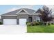 Brick house with two-car garage at 6611 Ventnor Pl, Indianapolis, IN 46217