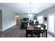 Spacious dining area with hardwood floors and dark wood dining table at 6611 Ventnor Pl, Indianapolis, IN 46217