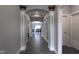 Gray hallway with dark flooring and arched entryways at 6611 Ventnor Pl, Indianapolis, IN 46217