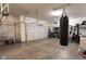 Garage with overhead storage and boxing equipment at 6611 Ventnor Pl, Indianapolis, IN 46217