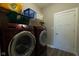Laundry room with washer, dryer, and shelving at 6611 Ventnor Pl, Indianapolis, IN 46217