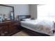 Bedroom with a double bed, dresser, and large window at 6611 Ventnor Pl, Indianapolis, IN 46217