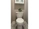 Bathroom with a toilet and a small cabinet at 6611 Ventnor Pl, Indianapolis, IN 46217